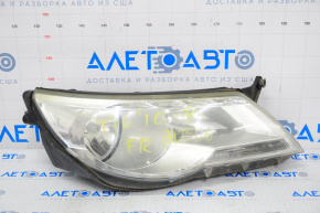 Far dreapta față VW Tiguan 09-11 goală, pre-restilizare, halogen, necesită polizare.