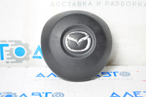 Airbagul de siguranță în volanul șoferului Mazda 3 14-16 BM pre-restilizare negru cu crom, emblema ruptă de fixare.