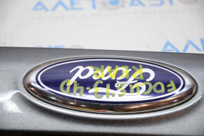 Moldura capacului portbagajului Ford Focus mk3 11-14 pre-restilizare 4 uși fără cameră cu emblema, defect la emblema