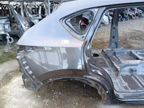 Aripa spate dreapta a un sfert de Mazda CX-5 17- pe caroserie, gri, ruginită, lovită.