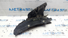 Parte inferioară căptușeală aripă stânga față Audi E-Tron 19-23 fragment lipsă, crăpături, elemente de fixare rupte