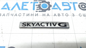 Emblema SKYACTIV G a Mazda CX-50 2023-25 pe portbagaj