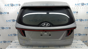 Дверь багажника в сборе Hyundai Tucson 22-26 Korea, тонировка, серебро R2T, Hybrid, вмятина, царапины на накладке, царапины на обшивке