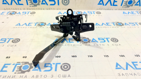 Замок капота Nissan Versa Note 13-19