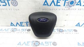 Airbag-ul de pe volanul șoferului pentru un Ford Edge 19-24 este negru și are o valvă ruginită.