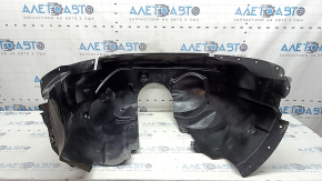 Căptușeala aripii stânga față a unui Ford Fusion mk5 17-20 este ruptă și uzată.