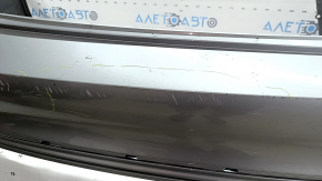 Бампер задний голый VW Jetta 22-26 серебро, царапины, надрывы, трещины, отсутствует фрагмент