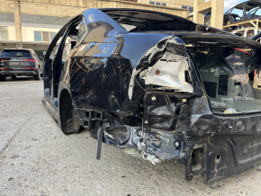 Aripă spate stânga VW Passat b8 16-19 USA pe caroserie, neagră, îndoită, găuri care nu provin din fabrică, crăpături