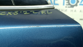 Ansamblu ușă spate stânga Mazda CX-5 17-25, nuanțat, albastru 45B, denivelare, zgârieturi, ornamentele se desprind