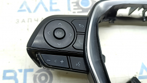 Butoanele de control al volanului pentru Toyota Venza 21-22 sunt negre cu negru lucios și cromat, zgârieturi