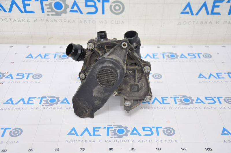 Помпа охлаждения с корпусом термостата в сборе VW Passat b7 14-15 USA 1.8Т