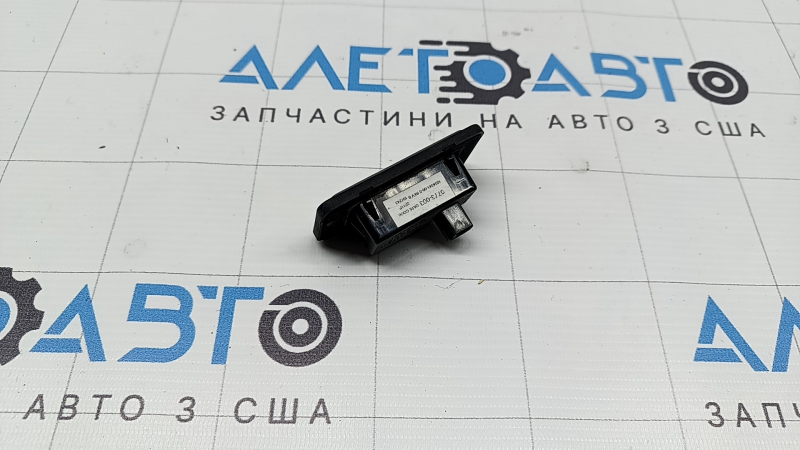 Подсветка номера двери багажника левая Tesla Model X 22-26