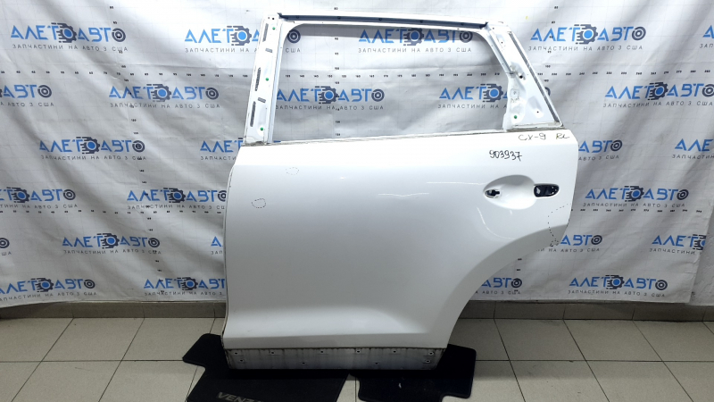 Дверь голая задняя левая Mazda CX-9 16-23 белый 25D, коррозия, царапины